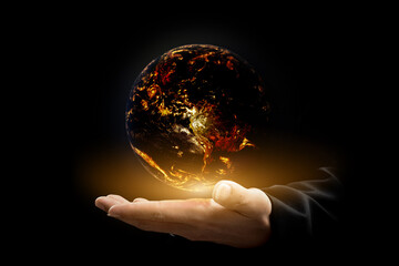 Canvas Print - environment concept. earth with light in hands on black background. elements of this image furnished