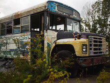 Outside View Of The Front Of An Abandoned School Bus