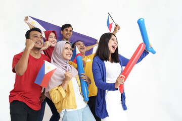 filipino group of people holding philippines flag celebrating independence day