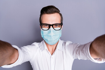 Poster - Self-portrait of his he attractive healthy guy wearing safety gauze mask stop contamination stay home influenza infection flu flue grippe pandemia preventive measures isolated gray color background