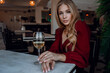 © Olena_Molchanova - woman with glass of white wine in cafe or restaurant. sexy young blonde girl