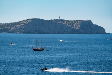 Wall Mural - Boat and jet sky in the Mediterranean Sea, Ibiza. Spain.