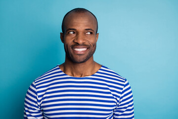 Wall Mural - Portrait of satisfied candid afro american guy look copyspace enjoy summer holiday free time wear striped sailor vest isolated over blue color background