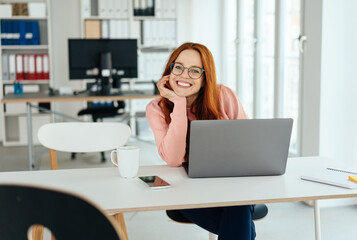 Attractive friendly young businesswoman smiling