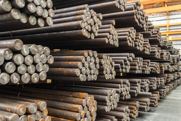 pack of steel round bar stack in layer inside large distribution warehouse. steel warehouse logistic