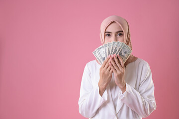 Wall Mural - Business concept. Muslim business girl holding money for buying.