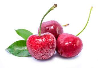 red cherries with leaf isolated on white background