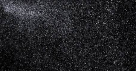Wall Mural - Natural white winter snowfall on a black background