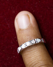 Wearing A Round Silver Ring