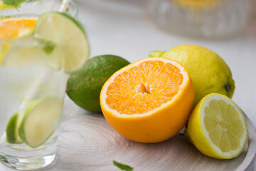 Water with fresh orange, lemon and lime slices.