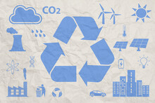 Blue Recycling Symbol And Ecology Icons On Crumpled Paper. Ecology Concept.