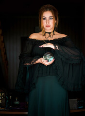 Woman fortune teller on a crystal ball, Concept of predictions, magic rituals and wicca