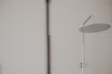 Wall Mural - Closeup shot of a shower in a bathroom with modern interior