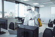 © likoper - Office disinfection during COVID-19 pandemic. Man in protective suit and face mask spraying for disinfection in the office