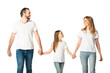 © LIGHTFIELD STUDIOS - happy casual family holding hands while walking isolated on white