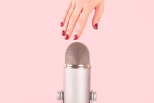 Woman Hand With Perfect Manicure Near The Microphone Is About To Do Nail Tapping. Making ASMR Sounds. Triggers For Relaxation, Good Sleep And Stress Relief.