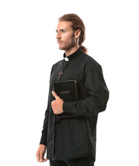 Wall Mural - Handsome priest with Bible on white background