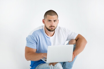 portrait of a man with a beard and a smile, white background