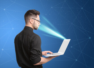 Facial recognition system. Man using laptop on blue background