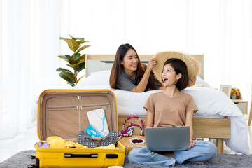 Young Asian women planning a journey trip in summer.