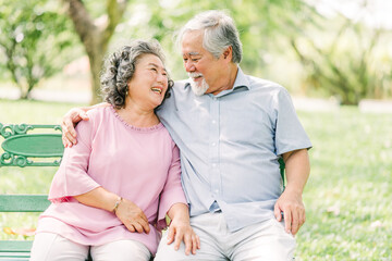 happy senior couple having a good time at park