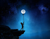 Fototapeta Na sufit - Kid boy catching moon . Mixed media