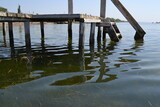 Fototapeta Pomosty - wooden pier in the water