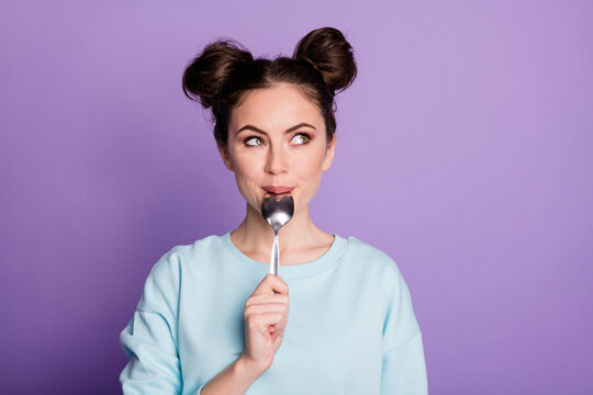 Close-up portrait of her she nice attractive dreamy curious girl licking spoon fantasizing healthy menu counting calories isolated on violet purple lilac bright vivid shine vibrant color background