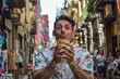 © Andrea - Young man eating street food in Italy during the holidays