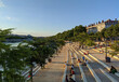 People enjoying the sunset on the steps of the Rhone coast near the Guillotiere bridge, Lyon, France
