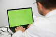 © veles_studio - doctor working on chroma key computer