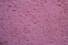 Pink Relief Background. The Wall Is Painted In A Bright Color.