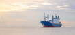 © panitan - logistics and transportation concept.cargo ship import export commerce sail boat at sea at twilight sky