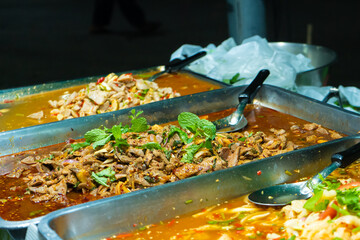 Wall Mural - Asian street food night market. Mobile food counter carts.