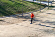 © 2Design - Side view of a senior man in sport clothes jogging in the park in a sunny day