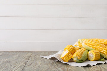 Fresh corn cobs on table