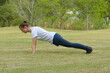 © Ranta Images - Young beautiful woman exercising at the park outdoors