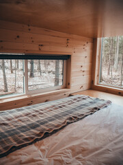 tiny home camper bedroom in the woods 