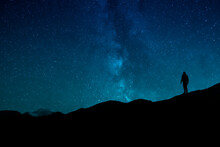 Man Standing Under The Stars At Night