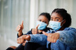 © AS Photo Family - Two african woman friends in jeans jacket wearing protective masks. Virus concept health, medical.