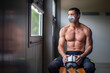 © Fran Rosado/ADDICTIVE STOCK - Strong mature male firefighter with naked torso sitting on bench in mask and holding a helmet while looking away