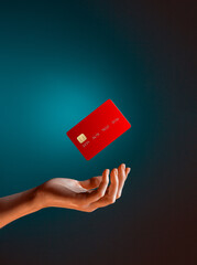 Close up female hand holds levitating template mockup Bank credit card with online service isolated on blue background