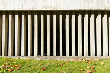 Portrait of concrete wall with visual gaps of the building