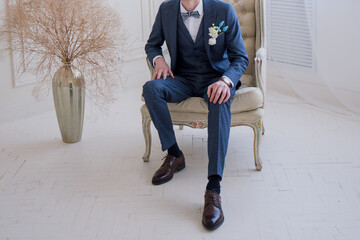 Poster - groom in a light studio at the wedding