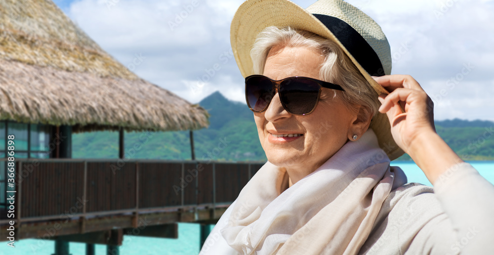 people and leisure concept - portrait of happy senior woman in ...