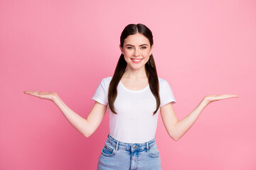 Poster - Portrait of her she nice-looking attractive lovely pretty content glad cheerful cheery girl holding on palms copy space ad advert tips feedback isolated over pink pastel color background