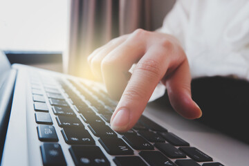 close up image of a person clicking button on the keyboard.