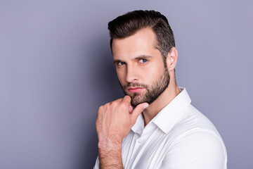 Poster - Close-up portrait of his he nice attractive virile brutal brunet guy model unshaven beard posing touching chin thinking isolated over gray pastel color background