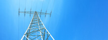 Electricity Background Banner Panorama - Voltage Power Lines / High Voltage Electric Transmission Tower With Blue Sky And Shining Sun