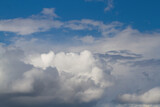 Fototapeta Na sufit - White, dark gray cumulus clouds. Blue sky. Natural background.